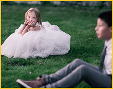 Image of young girl and boy on a lawn